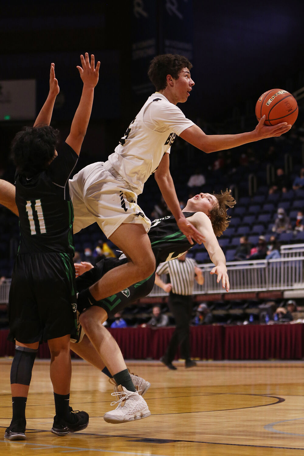 Eli Patterson jumps through two defenders